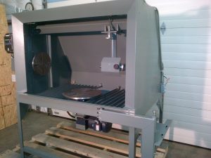 TSD RM2 Spray Booth with headstock, tailstock, turntable, and controller